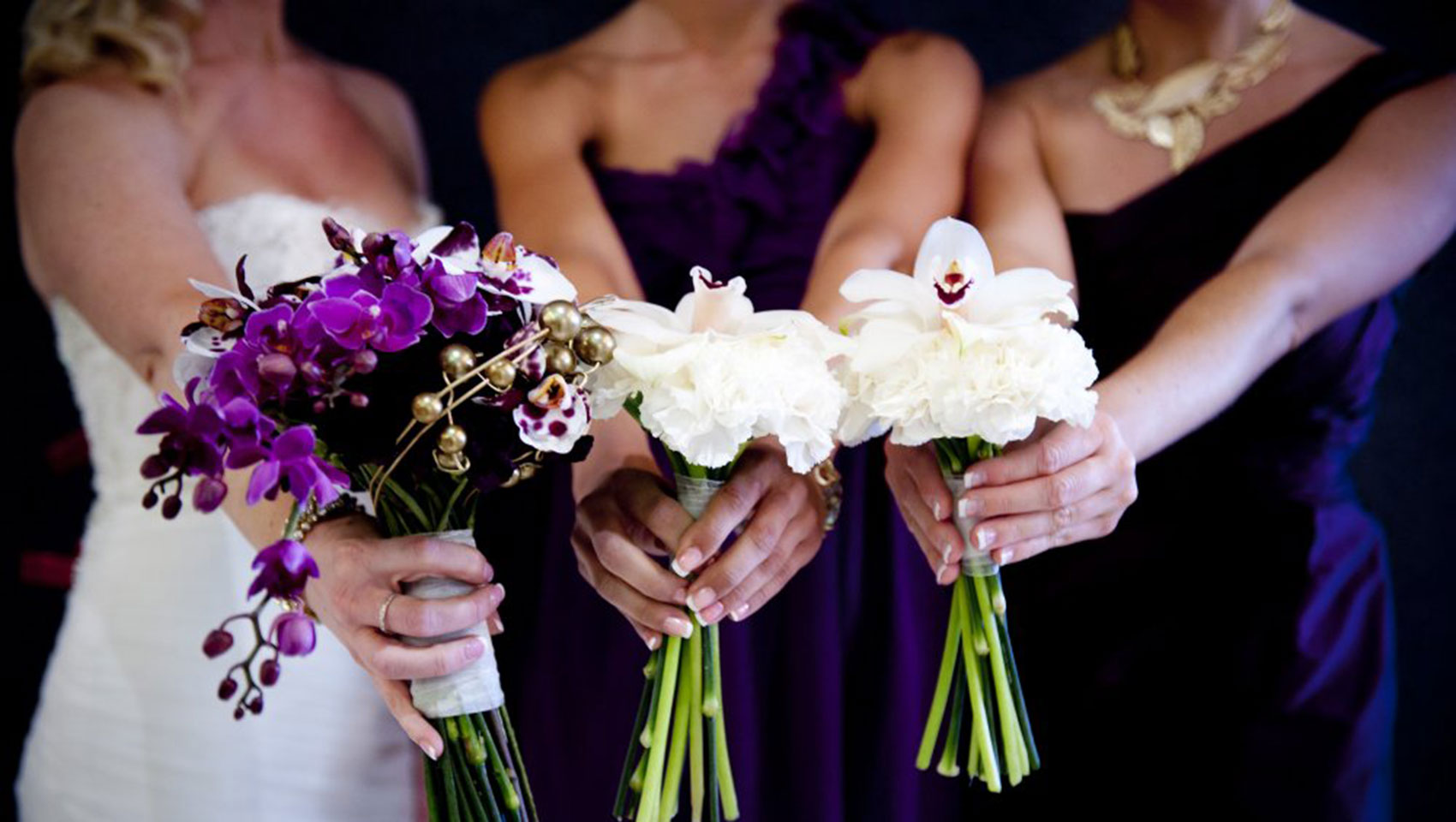 Bride and bridesmaids Holding Flowers